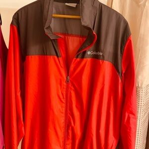 Men’s Red and Grey Columbia jacket with hood rolled inside collar. Front zip.